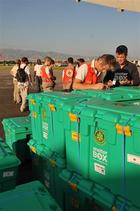 ShelterBoxes that have already arrived are unloaded ready for distribution.